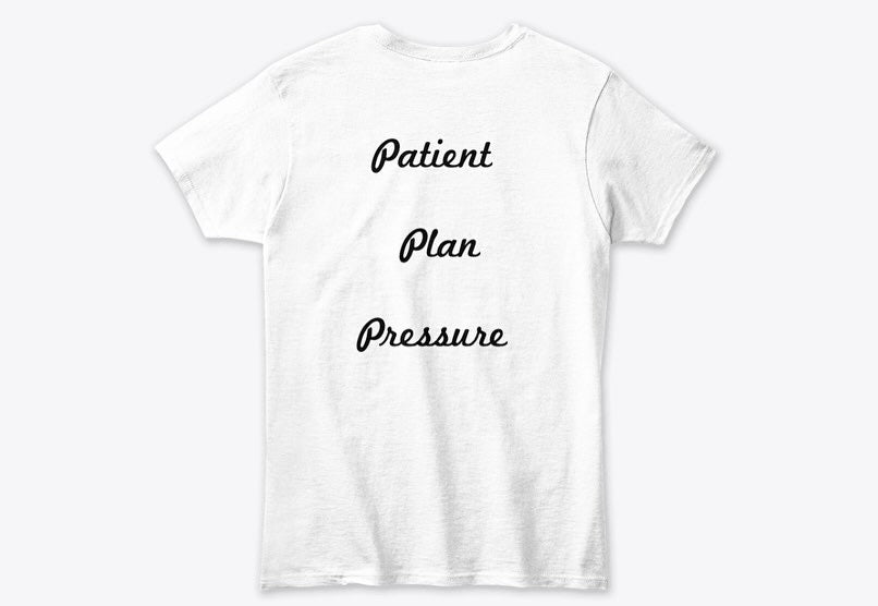 White T-shirt with "Patient, Plan, Pressure" design. Short Sleeve Tee from QP Crane.